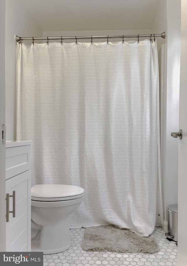 bathroom with tile patterned floors and toilet