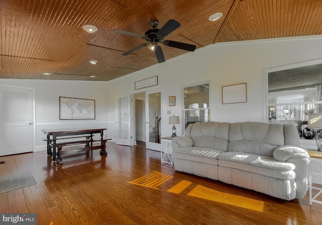 living area featuring a ceiling fan, hardwood / wood-style floors, french doors, lofted ceiling, and wood ceiling