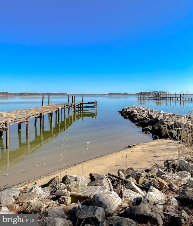 view of dock with a water view