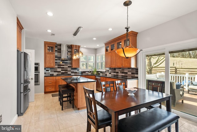 dining area featuring light tile patterned floors, a notable chandelier, and recessed lighting