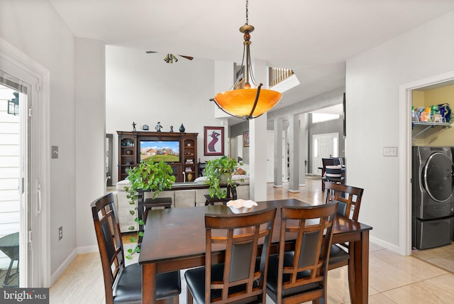 dining area featuring light tile patterned floors and baseboards