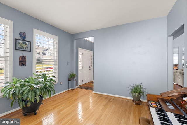 interior space with hardwood / wood-style floors and baseboards