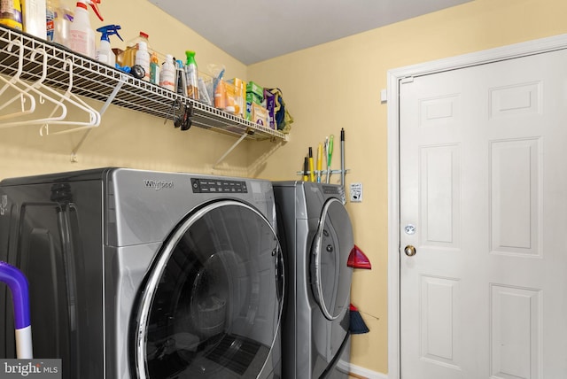 washroom with washer and clothes dryer and laundry area