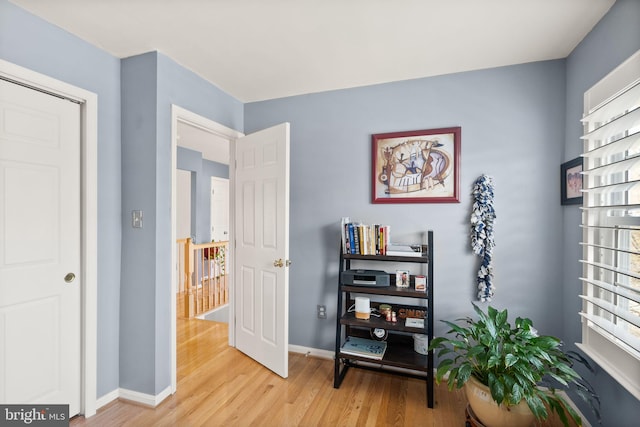 sitting room with light wood finished floors and baseboards