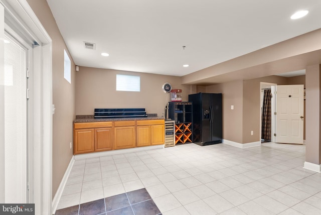 bar featuring wine cooler, visible vents, baseboards, and black refrigerator with ice dispenser