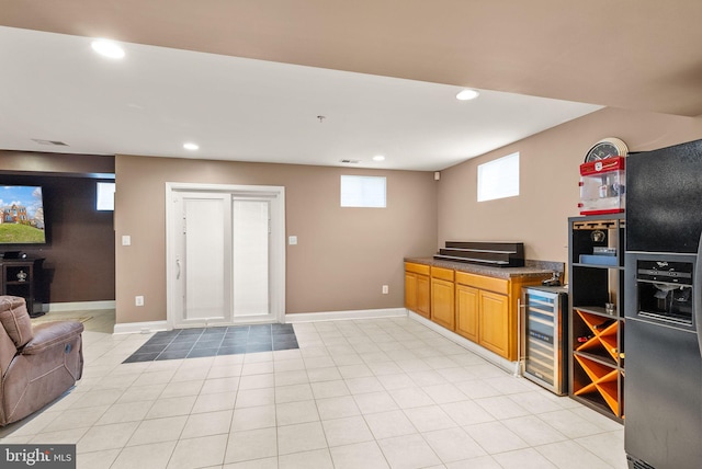 bar featuring recessed lighting, baseboards, and beverage cooler