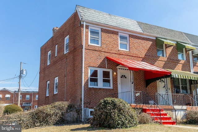 view of front of house with brick siding