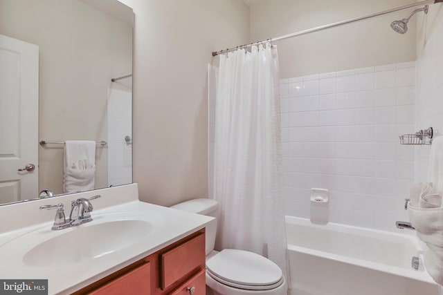 bathroom featuring toilet, vanity, and shower / bath combo