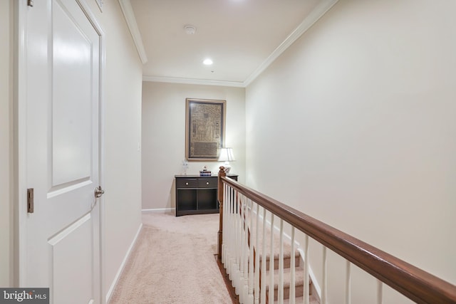 corridor with crown molding, baseboards, an upstairs landing, carpet flooring, and recessed lighting