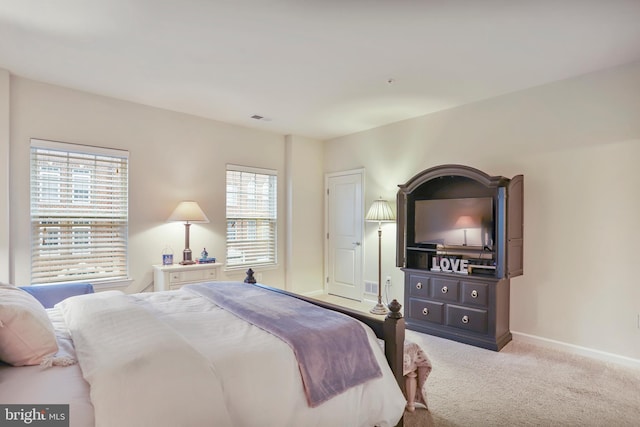 bedroom featuring carpet flooring, baseboards, and visible vents