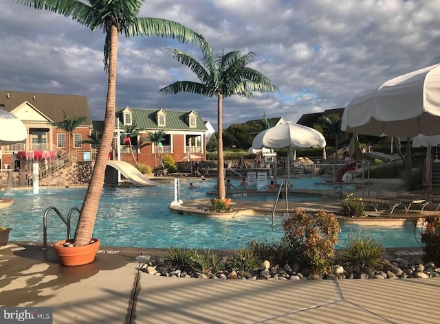 view of pool with a water slide