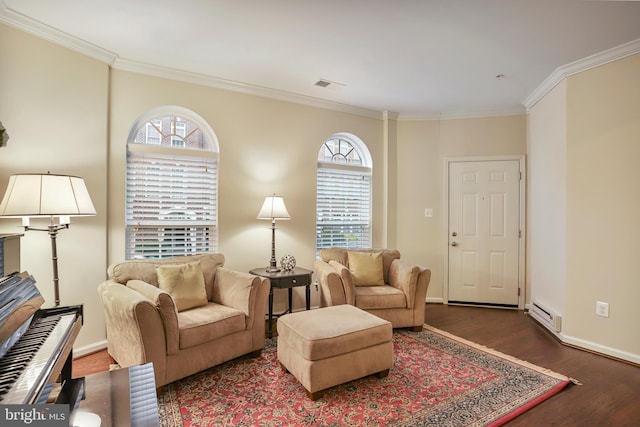 living area with crown molding, wood finished floors, visible vents, and baseboards