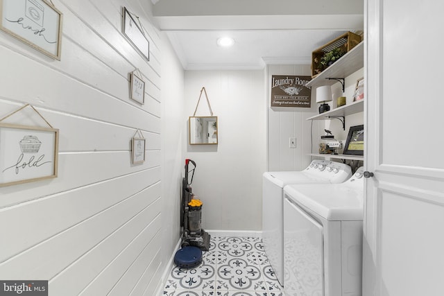 laundry area with laundry area, crown molding, baseboards, and separate washer and dryer