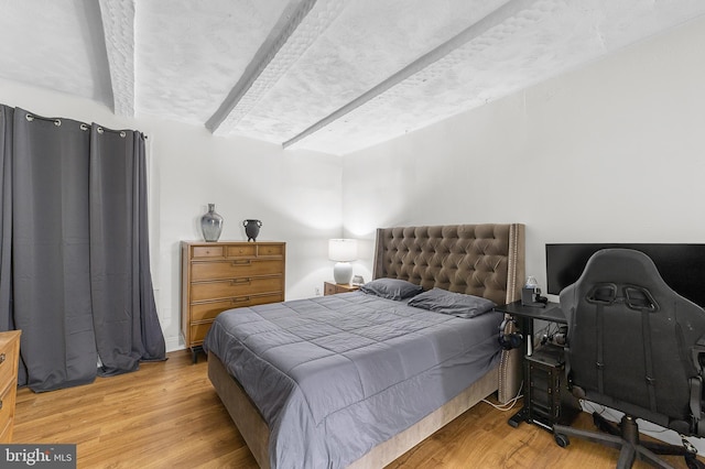 bedroom with light wood-style floors