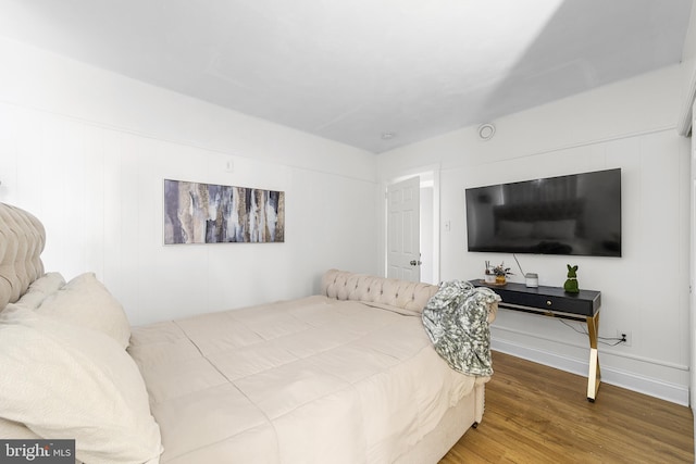 bedroom with wood finished floors