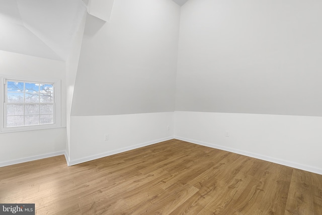 empty room featuring baseboards and wood finished floors