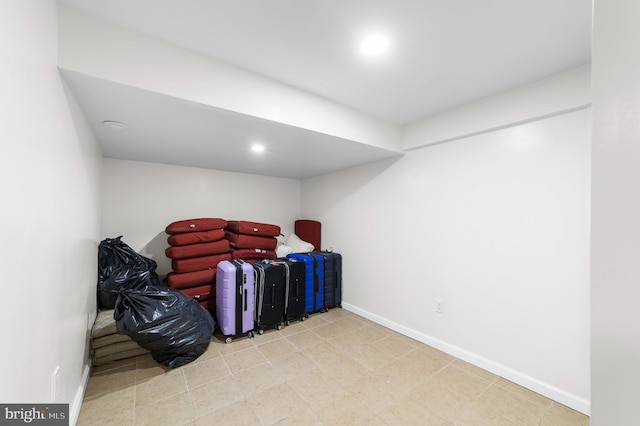 interior space featuring recessed lighting and baseboards