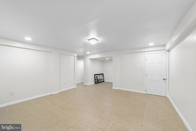 finished basement with recessed lighting and baseboards