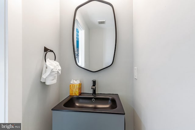 bathroom with visible vents and vanity