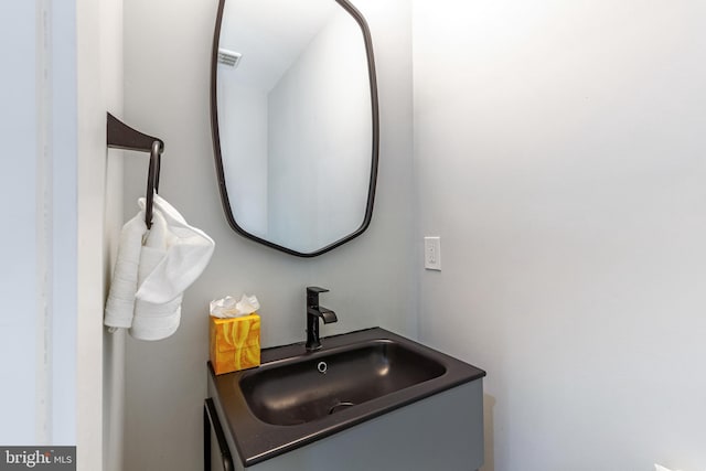 bathroom featuring visible vents and vanity