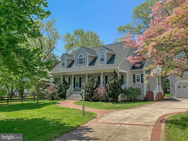 cape cod house with a garage, a front yard, a porch, and driveway