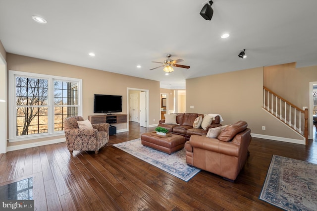 living area featuring baseboards, recessed lighting, dark wood-style flooring, ceiling fan, and stairs