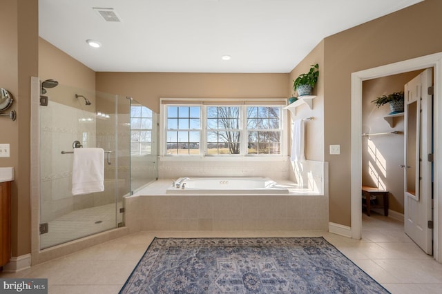 full bathroom featuring visible vents, baseboards, a garden tub, a stall shower, and tile patterned floors