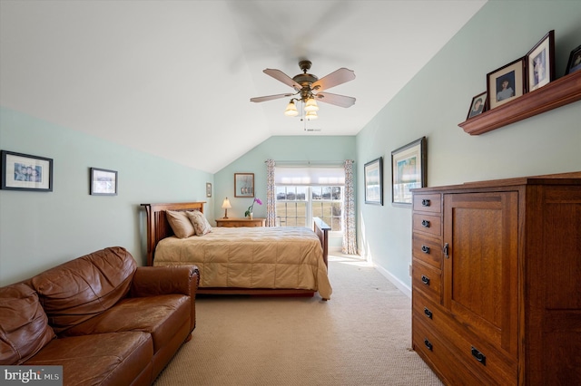 bedroom featuring a ceiling fan, lofted ceiling, light colored carpet, and baseboards