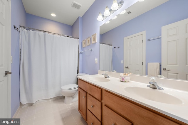 full bath featuring double vanity, toilet, visible vents, and a sink