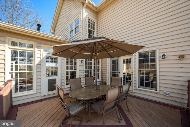 wooden deck with outdoor dining area