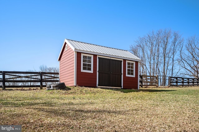 view of shed featuring fence