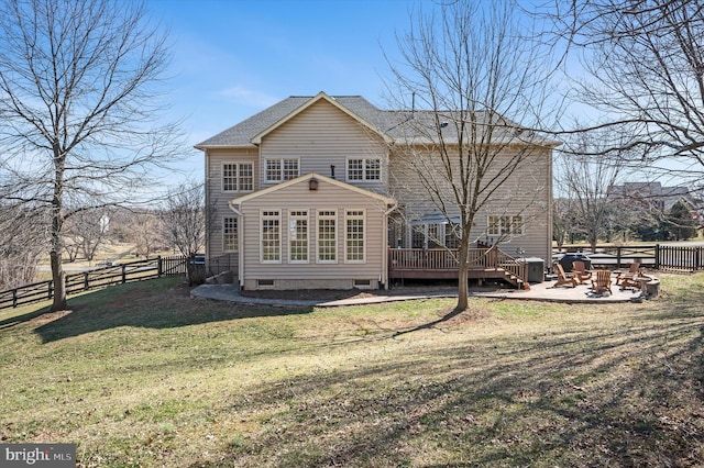 back of house with a patio, fence, a yard, a fire pit, and a deck