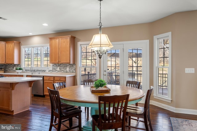 dining area with recessed lighting, baseboards, and dark wood-style flooring