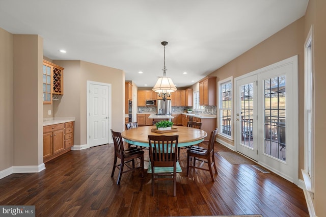 dining area with recessed lighting, dark wood-style floors, visible vents, and baseboards