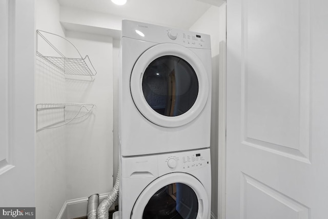 laundry area with laundry area and stacked washer and clothes dryer