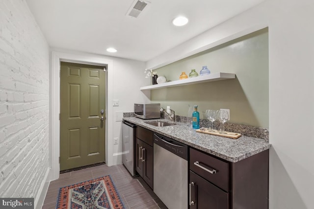 bar with appliances with stainless steel finishes, a sink, indoor wet bar, recessed lighting, and visible vents