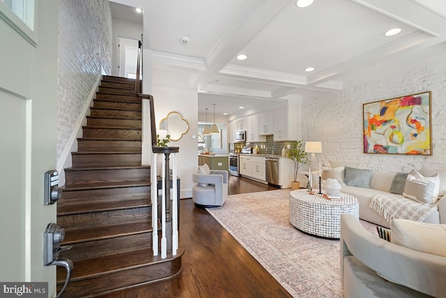 living area with crown molding, dark wood-style flooring, beamed ceiling, stairway, and coffered ceiling
