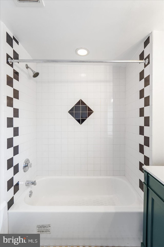 bathroom featuring vanity and tub / shower combination