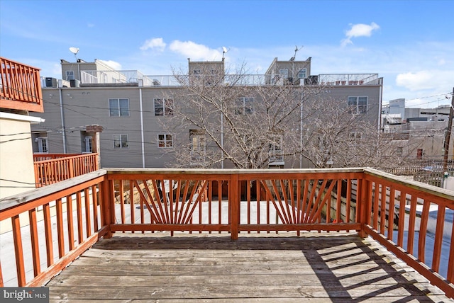 wooden deck with a view of city