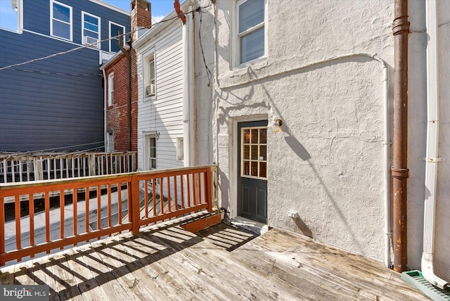 doorway to property featuring stucco siding