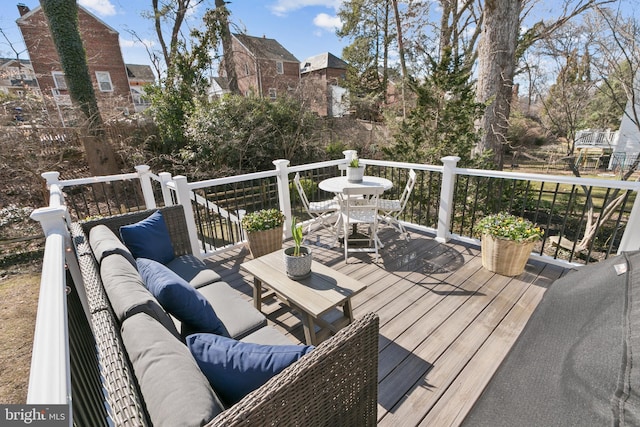 wooden deck with outdoor lounge area