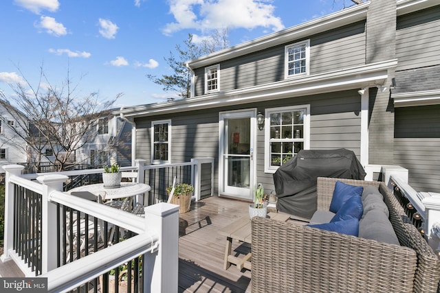 wooden terrace with area for grilling