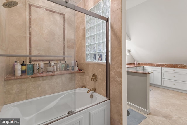 bathroom with tile patterned flooring and lofted ceiling