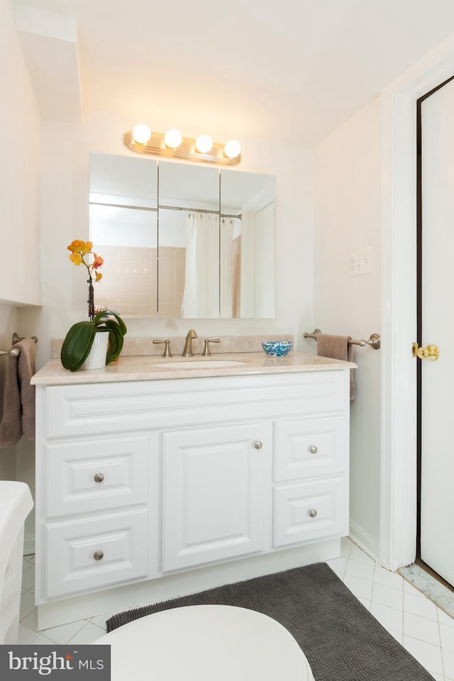 full bath with tile patterned floors and vanity