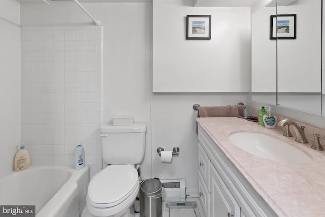 bathroom with toilet, vanity, and bathtub / shower combination