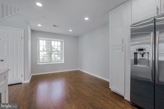 unfurnished dining area with recessed lighting, baseboards, and dark wood-style flooring