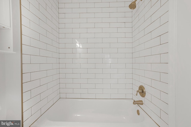 bathroom with shower / bath combination