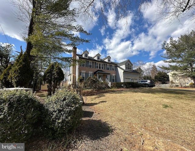 exterior space with a front yard and a chimney