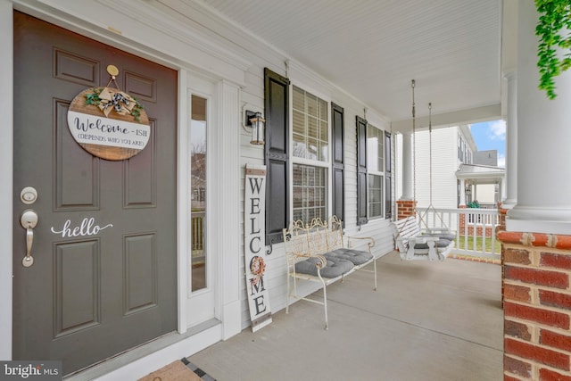 property entrance featuring covered porch