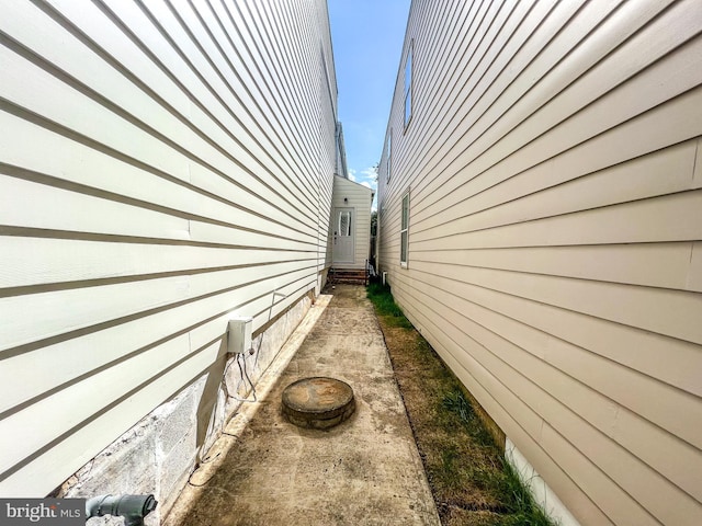 view of side of home with entry steps